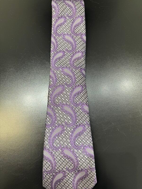 A purple tie with a paisley pattern on it