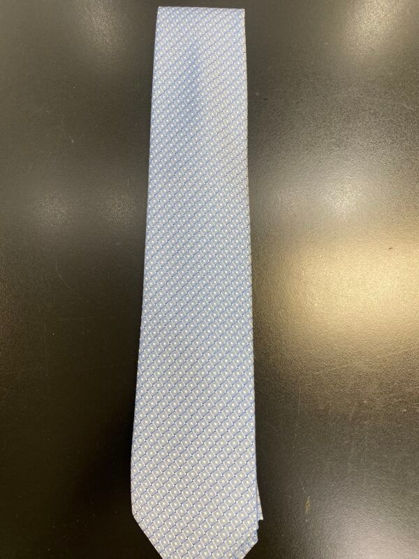 A white tie is sitting on top of a black table.