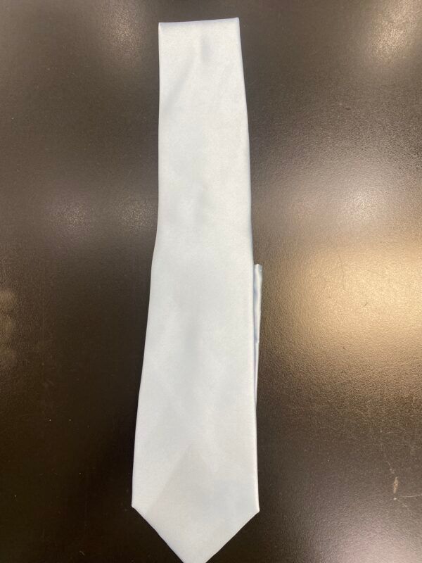 A white tie is sitting on a black table.