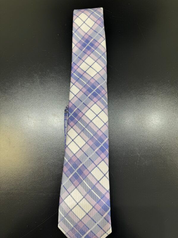 A purple and white plaid tie is sitting on a black table.