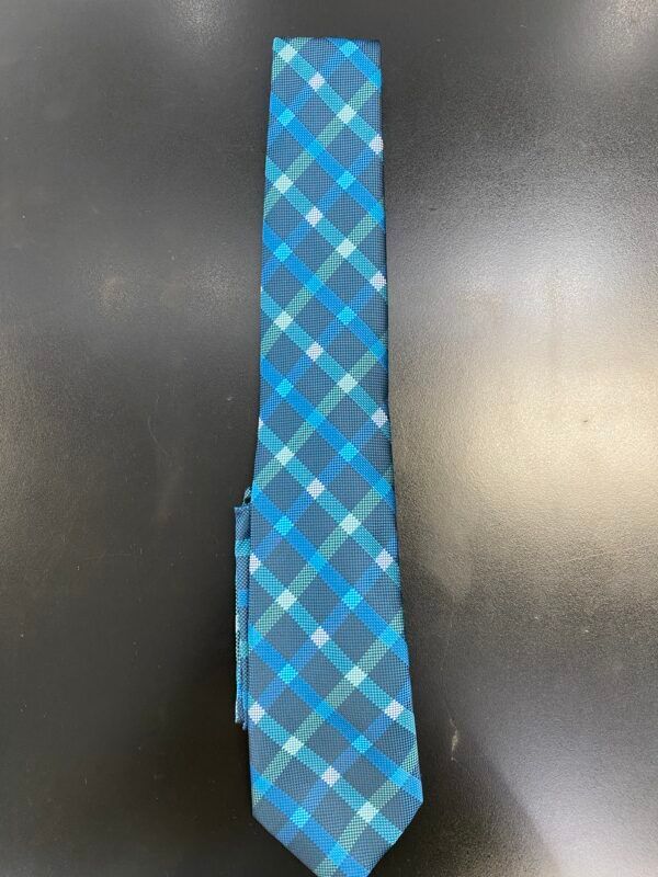 A blue and gray plaid tie is sitting on a black table.