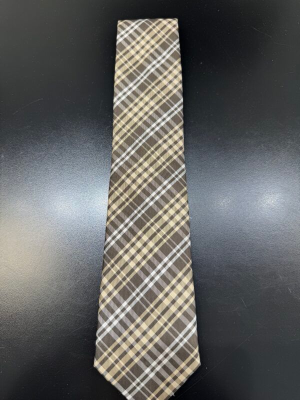 A brown and white plaid tie is sitting on a black table.