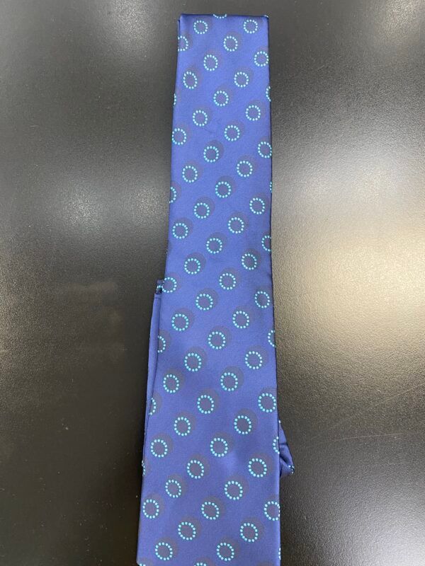 A blue tie with white circles on it