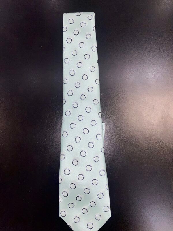 A white tie with black circles on it