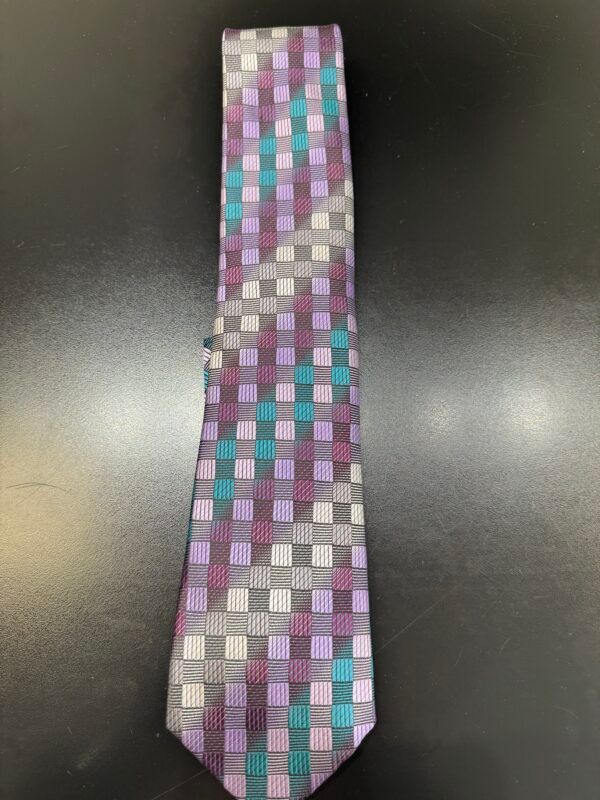 A tie with purple and blue squares on it