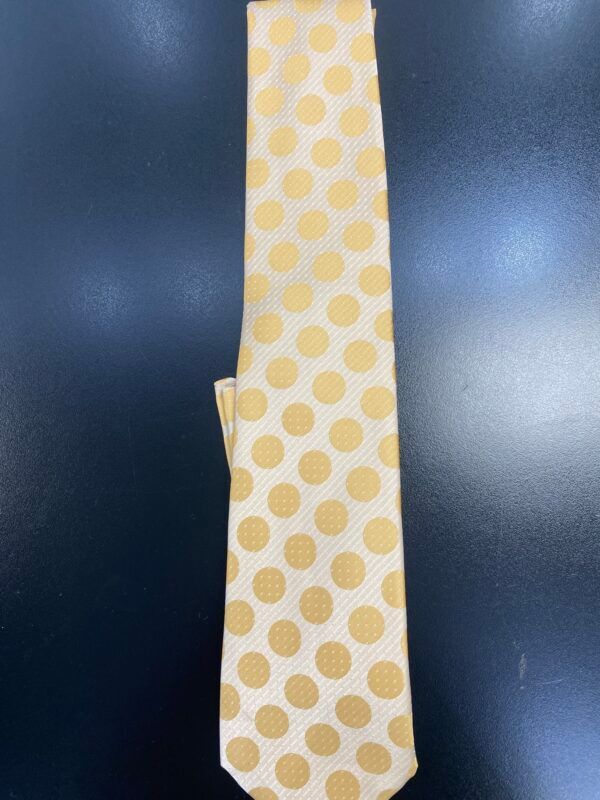 A white tie with yellow polka dots on it
