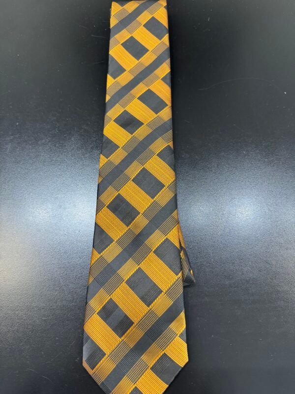 A yellow and black tie with squares on it