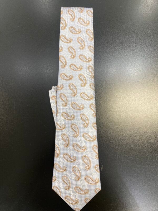 A white tie with a paisley pattern on it