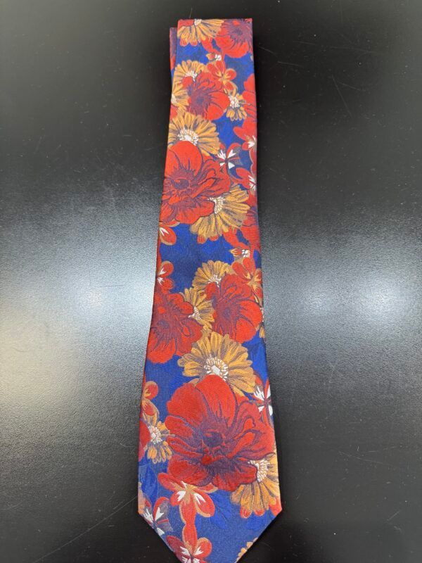 A red and blue tie with flowers on it