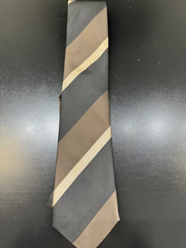A striped tie is sitting on a black table