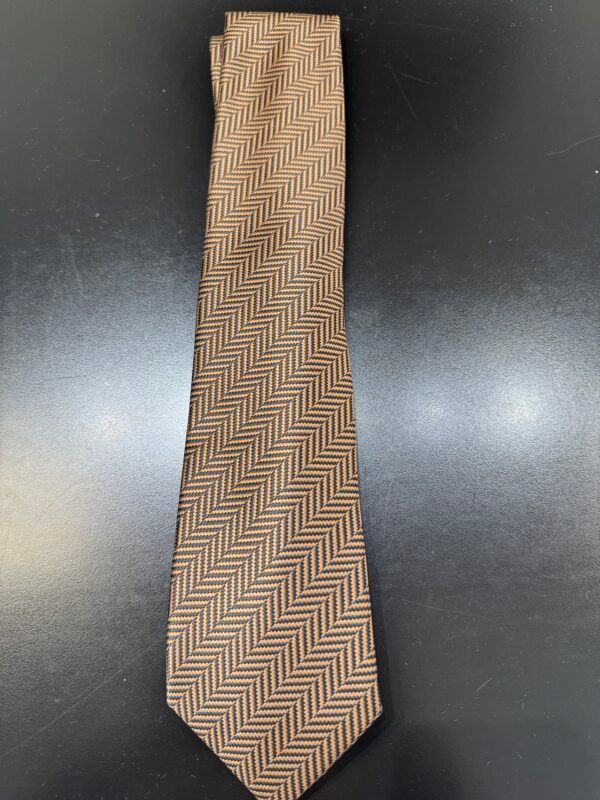 A brown tie with a herringbone pattern on it