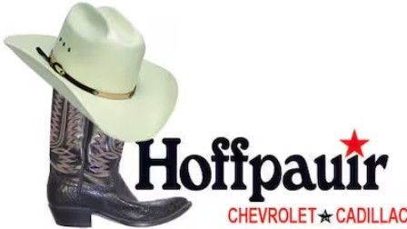 Cowboy hat and boot leaning on Hoffpauir Chevrolet Cadillac logo with a red star.