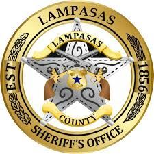 Lampasas County Sheriff's Office badge with star, crossed guns, and text in gold and silver.