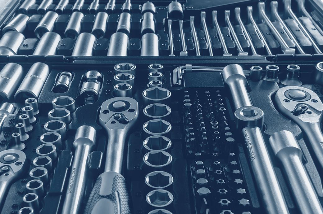 Tool set with sockets and ratchets arranged neatly.