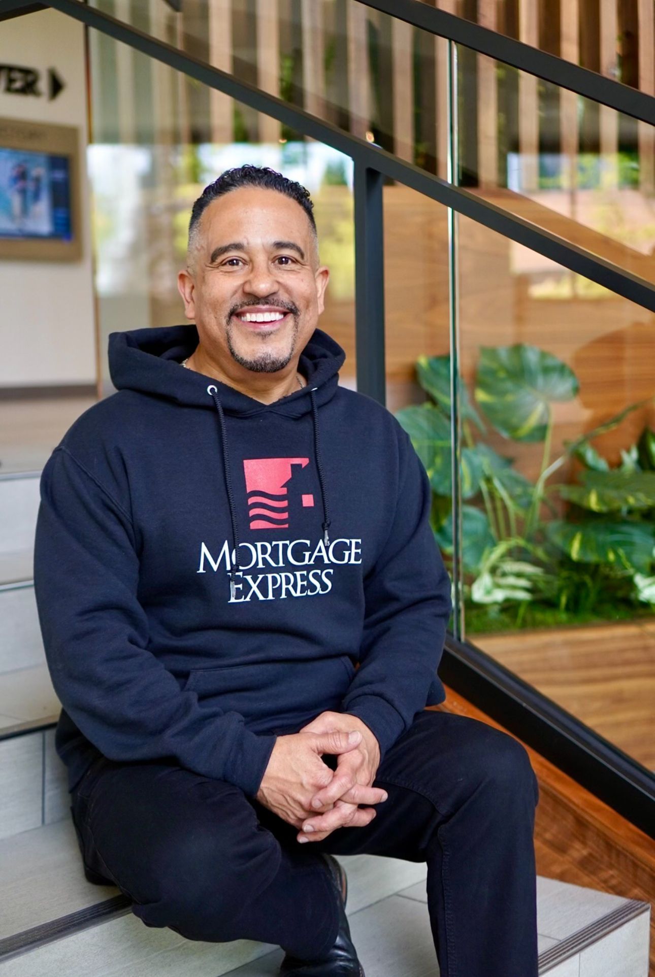 Man in black hoodie with 