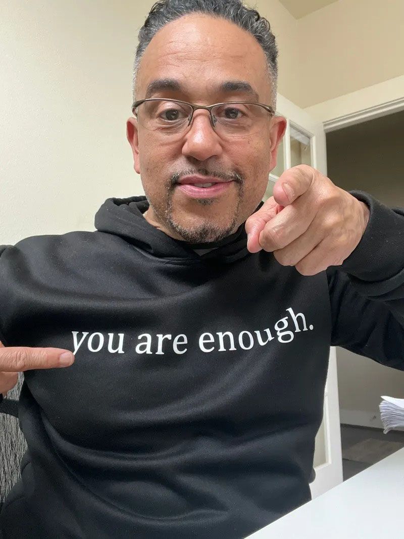 Man in black hoodie with 