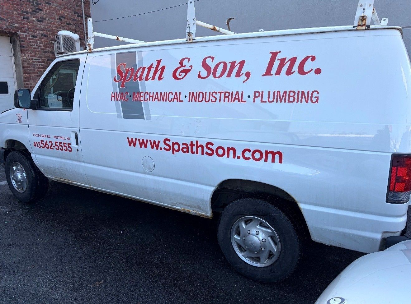 White van with company logo Spath & Son, Inc. for HVAC, mechanical, industrial, and plumbing services.