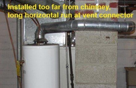 Water heater with improperly installed vent pipe, far from the chimney, with a long horizontal run.