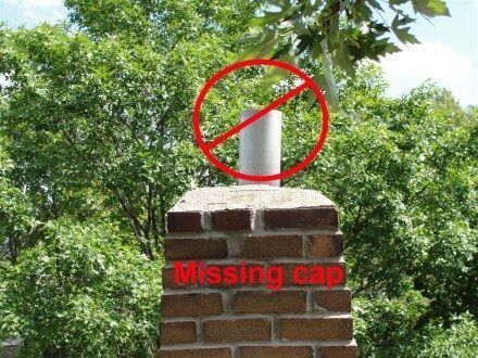 Brick chimney missing a cap with a red 