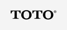 TOTO logo in black text, with a registered trademark symbol, on a light grey background.