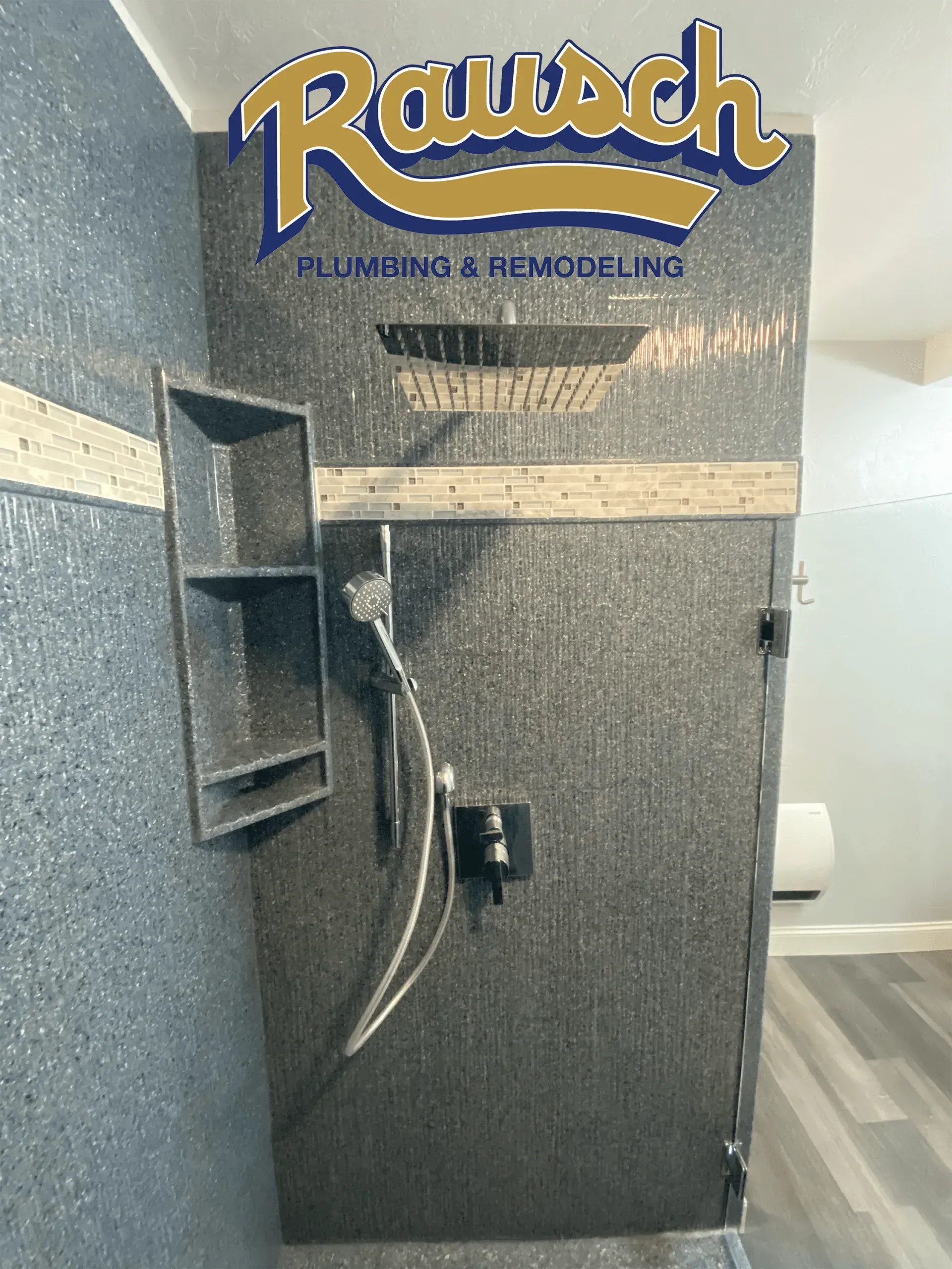 Modern shower with dark mosaic tile, overhead rain shower, built-in shelf, and handheld showerhead.