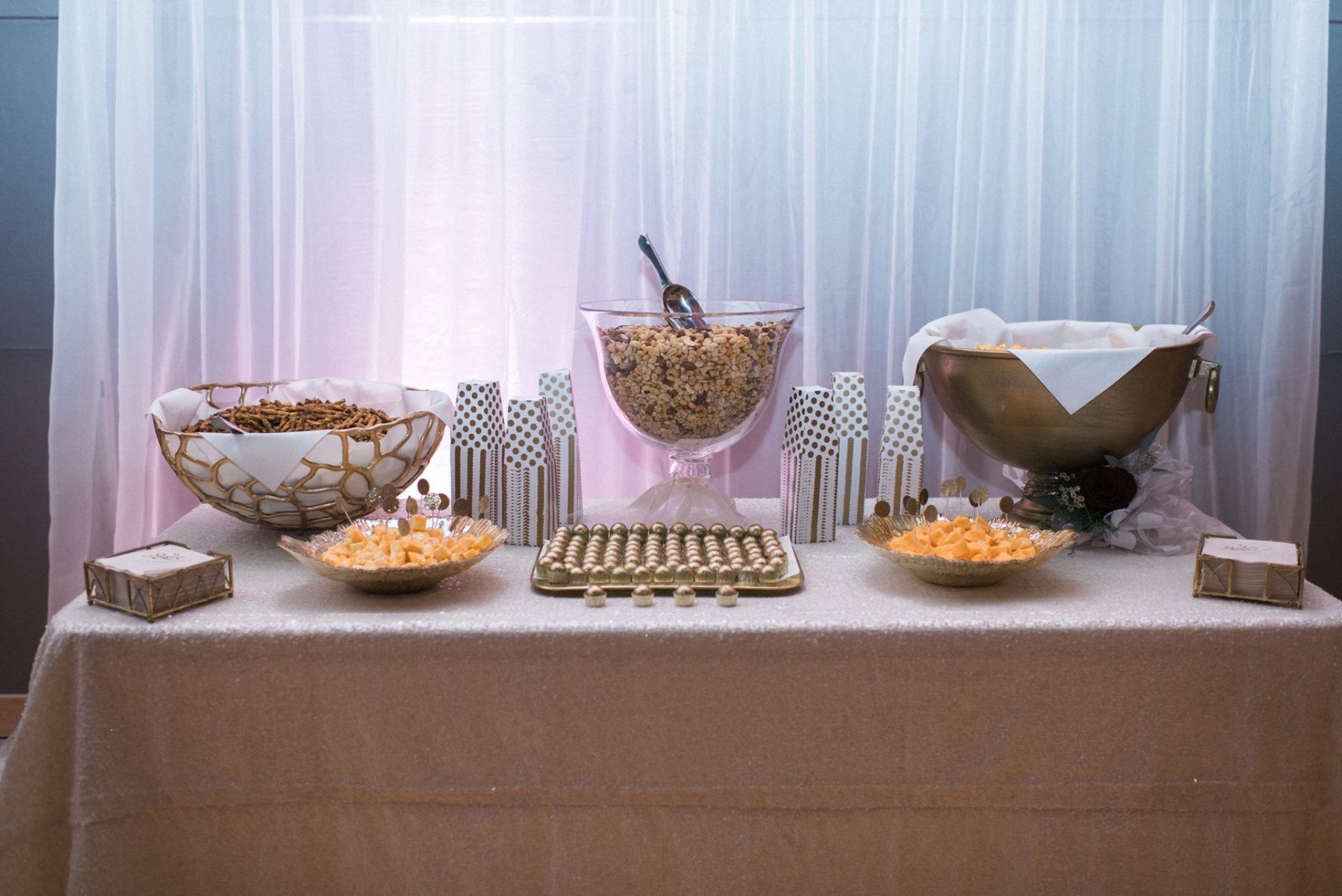 A table with bowls of food and a bowl of cereal on it.