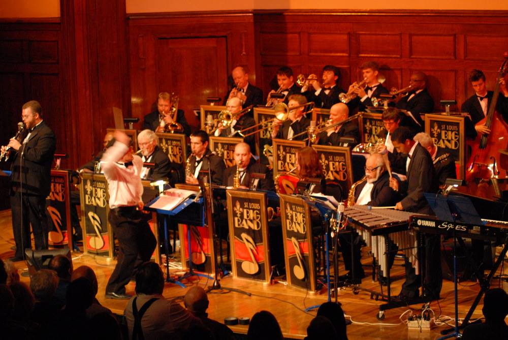 A jazz band is performing in front of a crowd