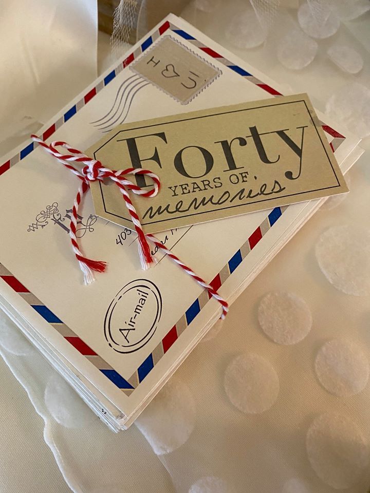 A stack of envelopes with a tag that says forty years of memories