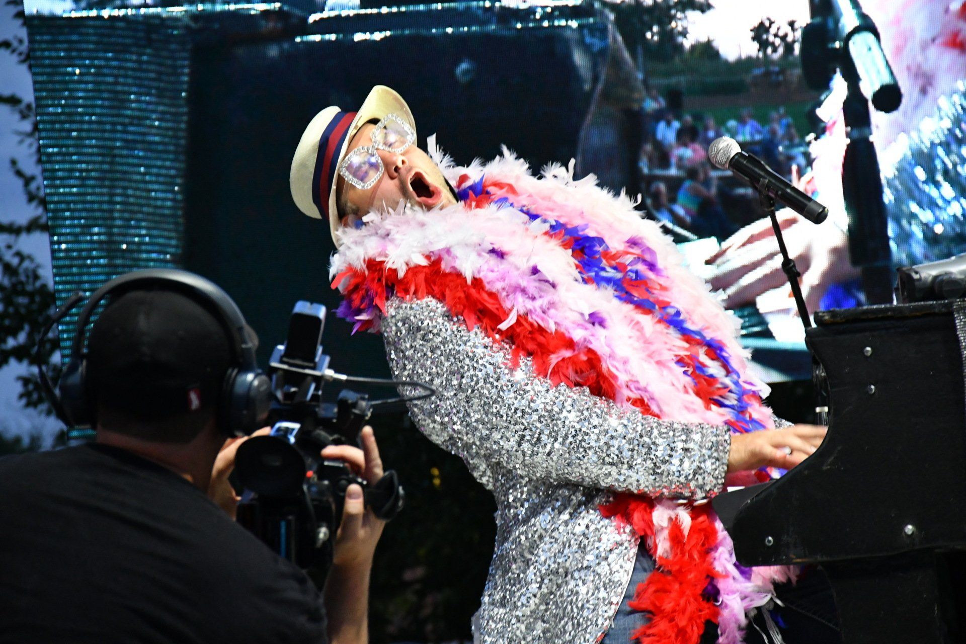 man singing while playing guitar