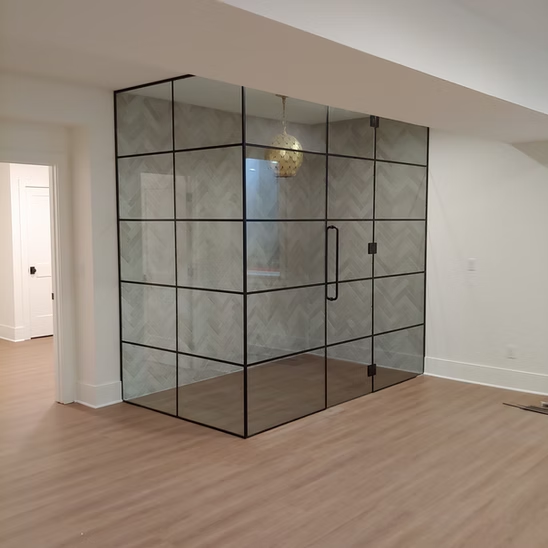 A room with a glass wall and a wooden floor