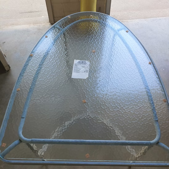 A glass table with a label on it that says gas