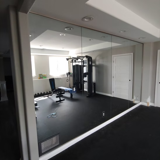 A gym with a large mirror on the wall