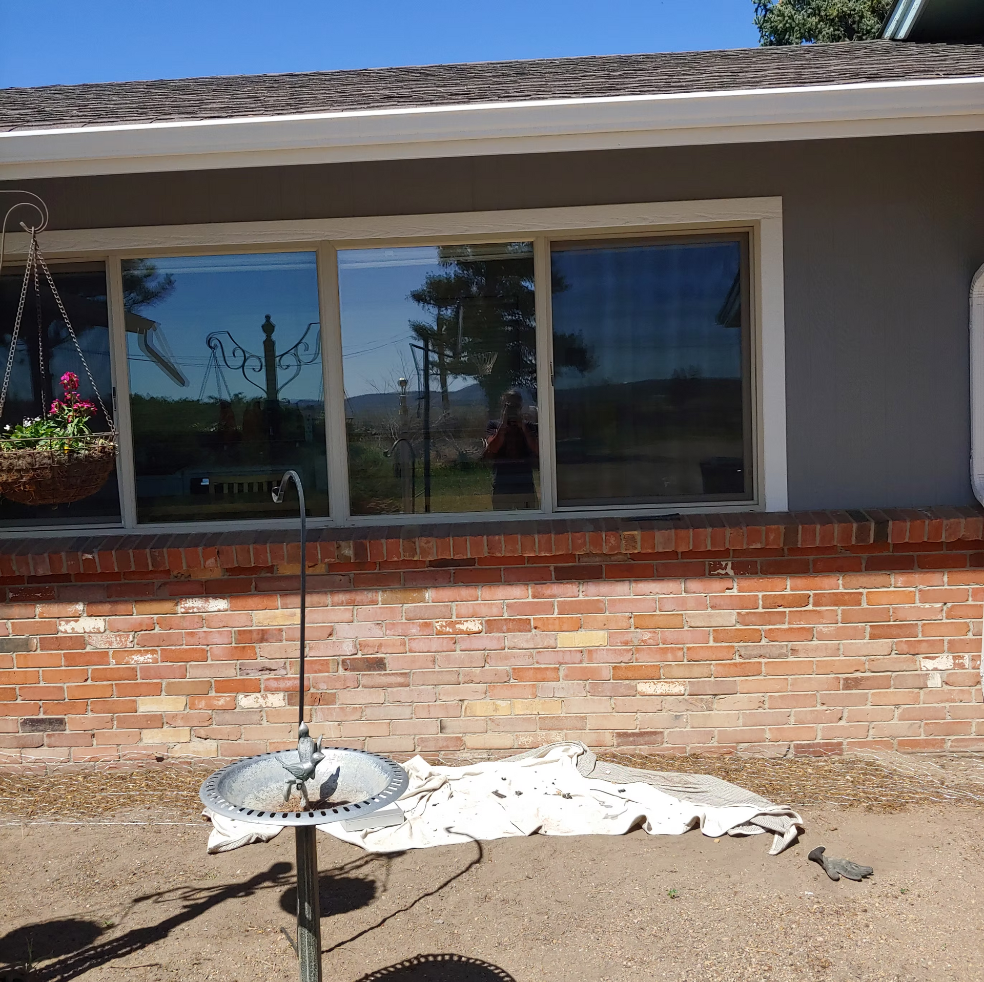 A house with a bird bath in front of it