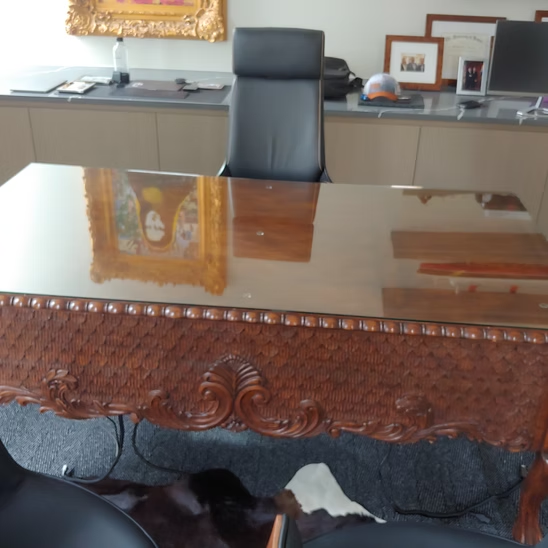 A chair sits at a desk with a picture on it