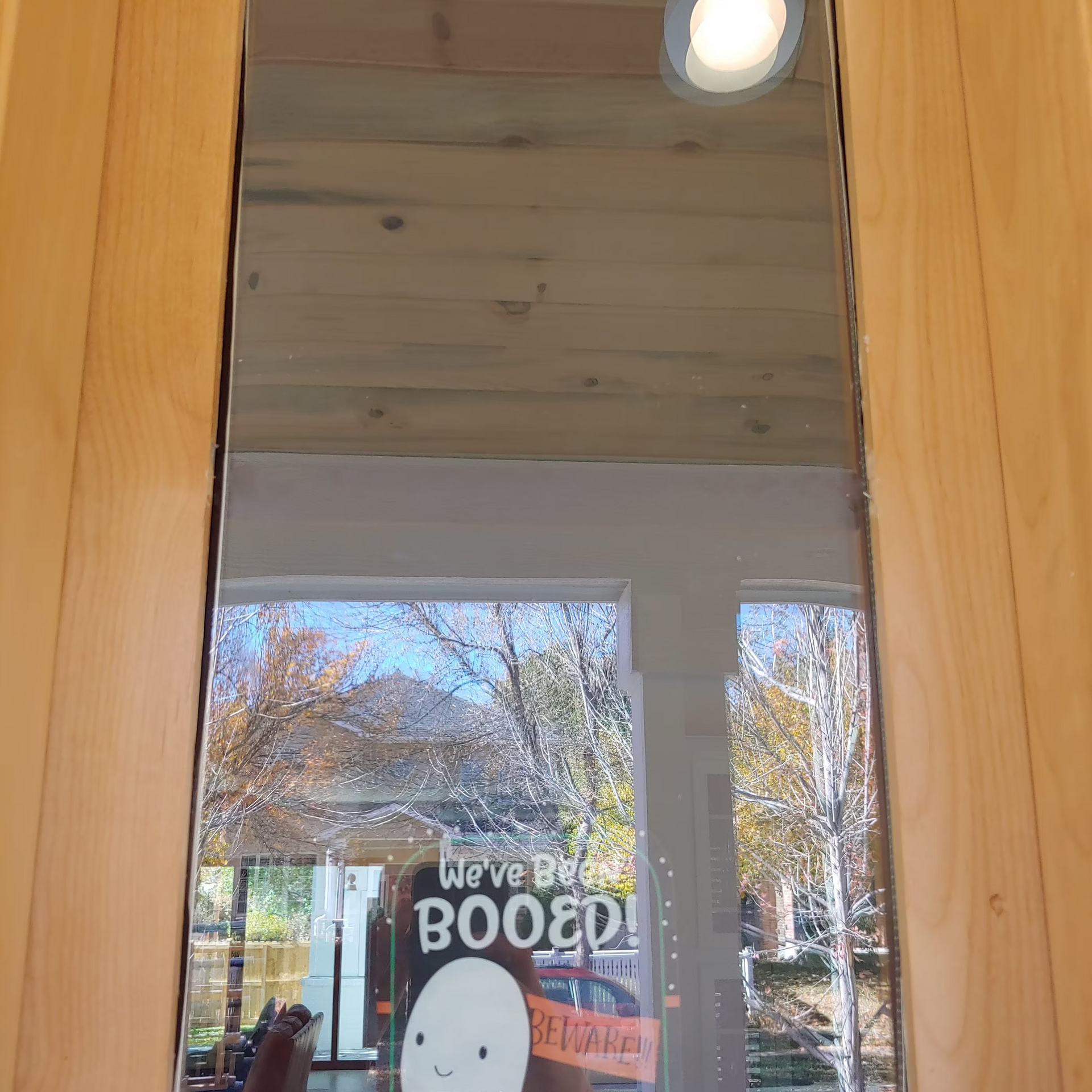 A mirror with a sign that says we 've been booed