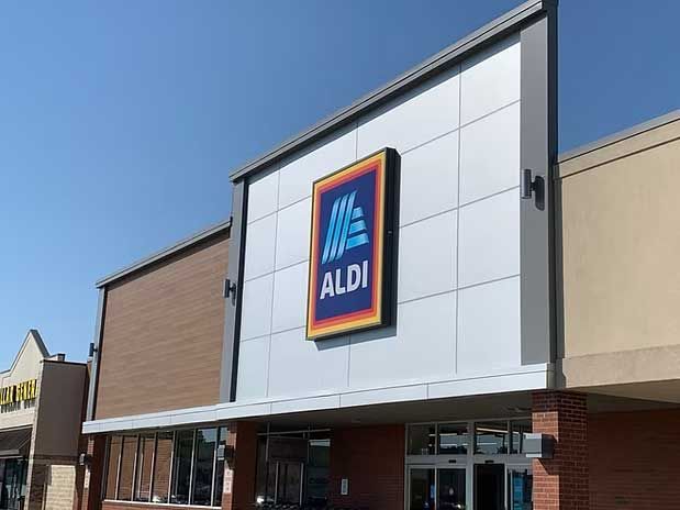 Exterior view of an ALDI grocery store with the company logo prominently displayed on the facade.