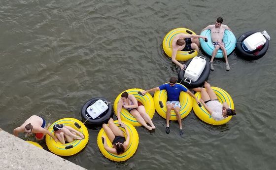 people enjoying the river tubing