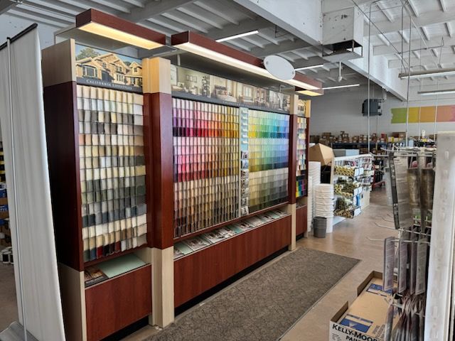 A wall of paint samples in a store.