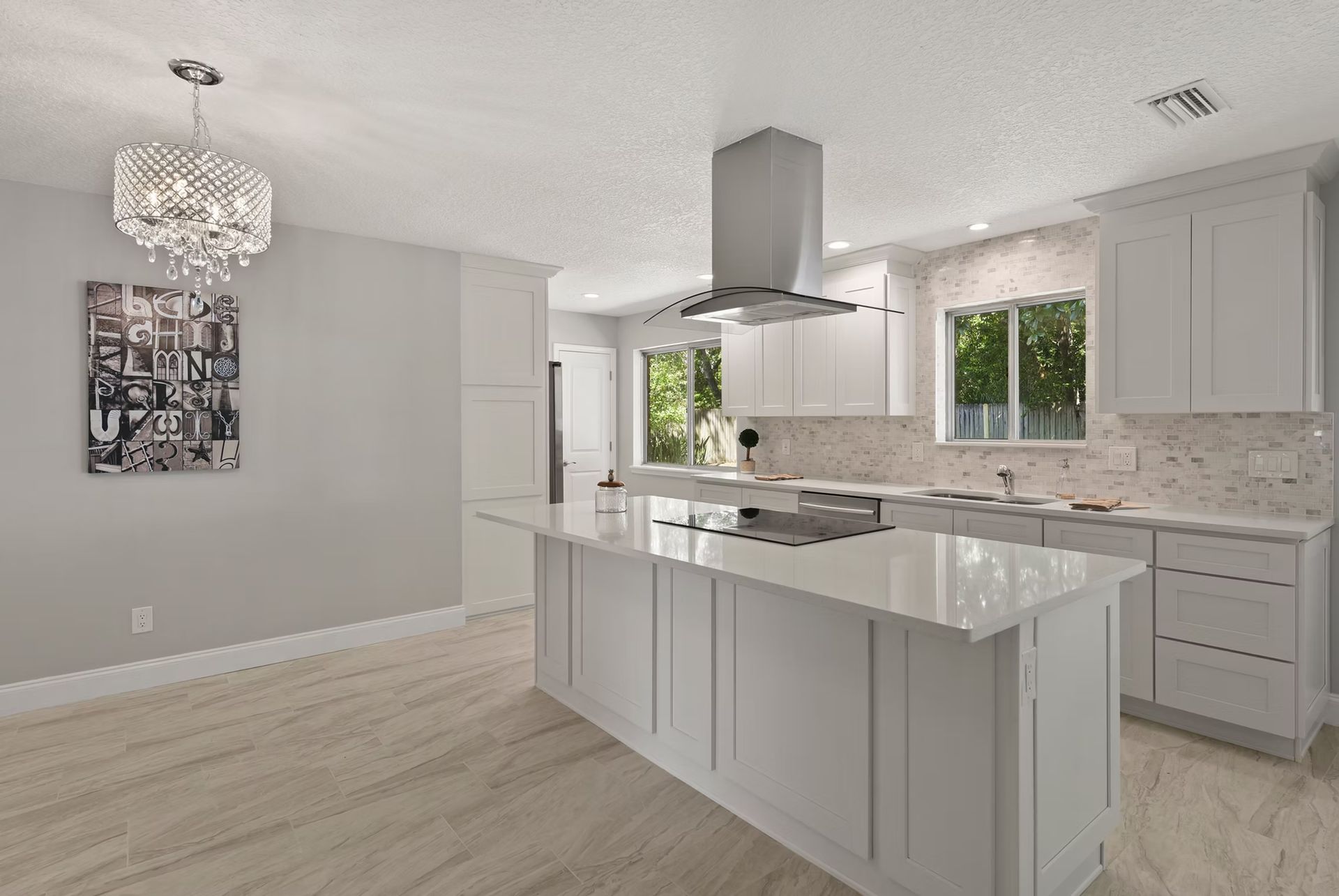 There is a large island in the middle of the kitchen.
