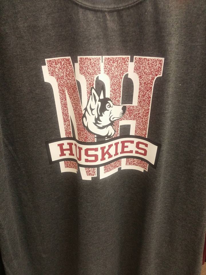 A gray shirt with the word huskies on it