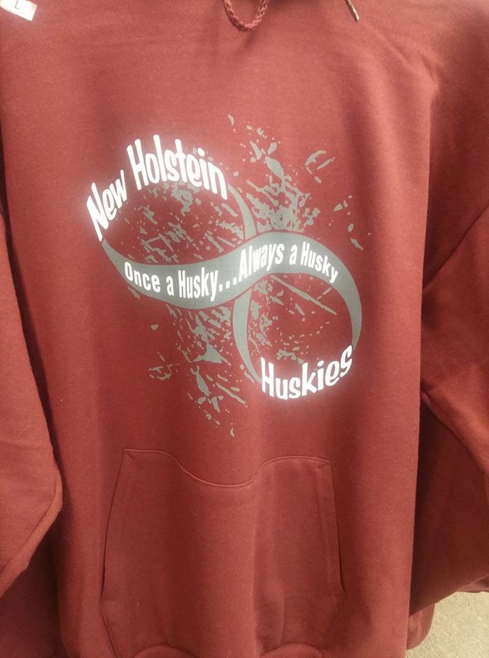 A red hoodie that says new holstein once a husky always a husky huskies