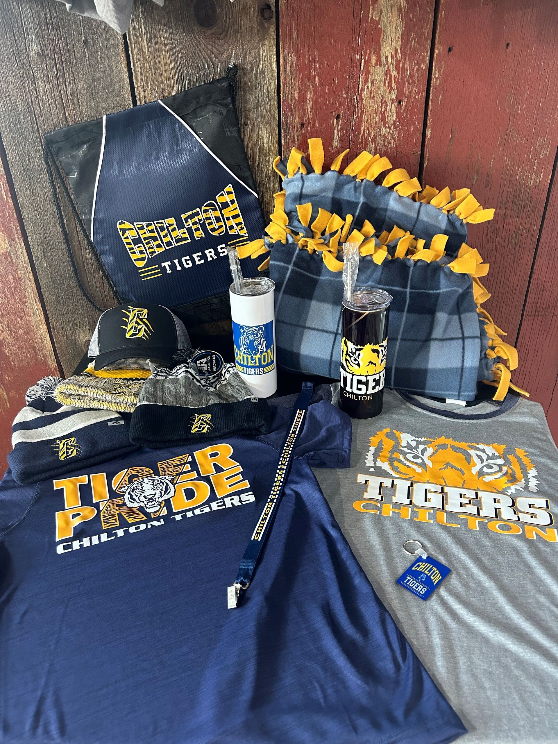 A table topped with a variety of tigers related items.