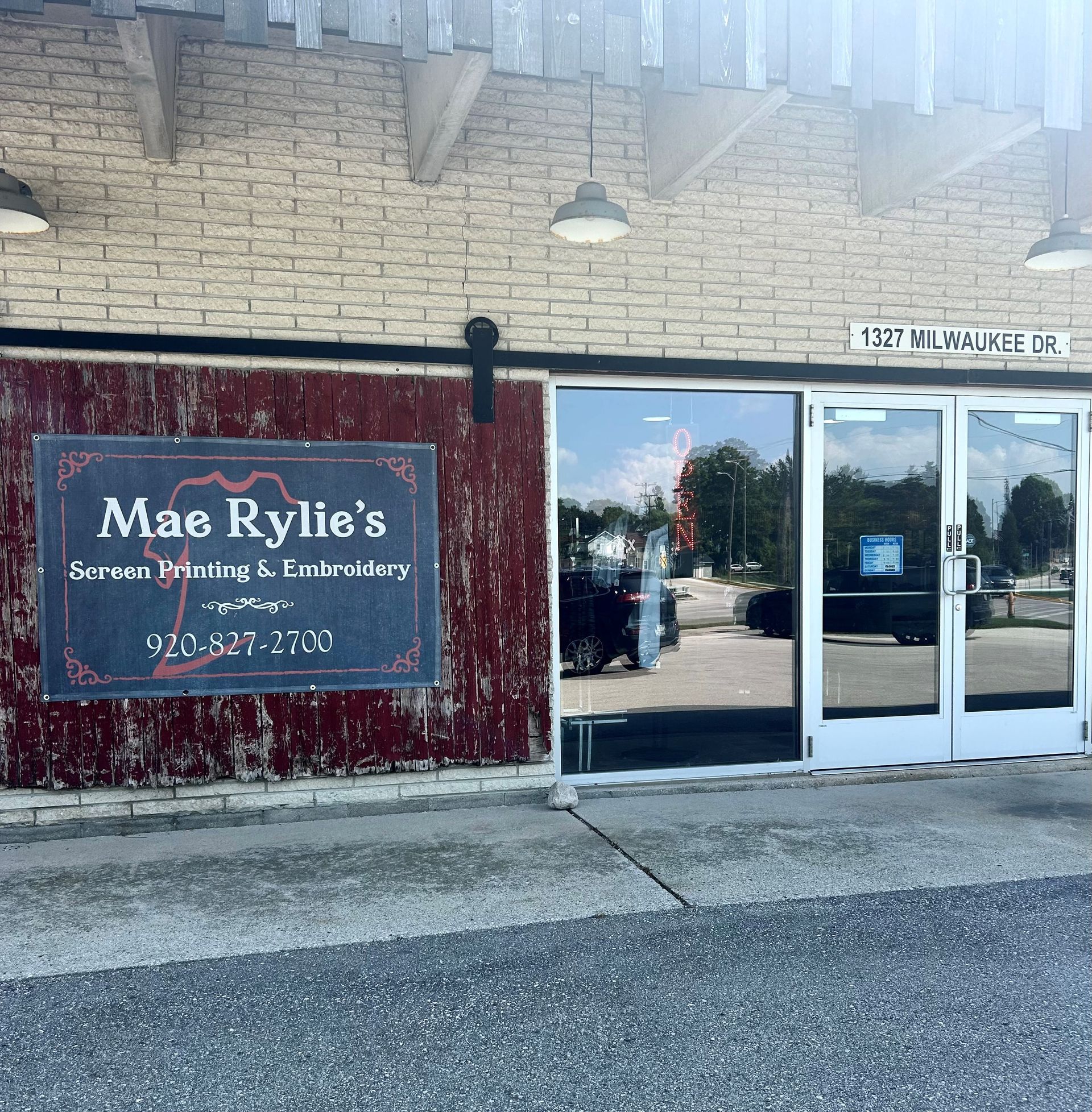 A sign for mae rylie 's screen printing and embroidery