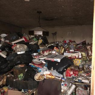 a room filled with lots of trash and boxes