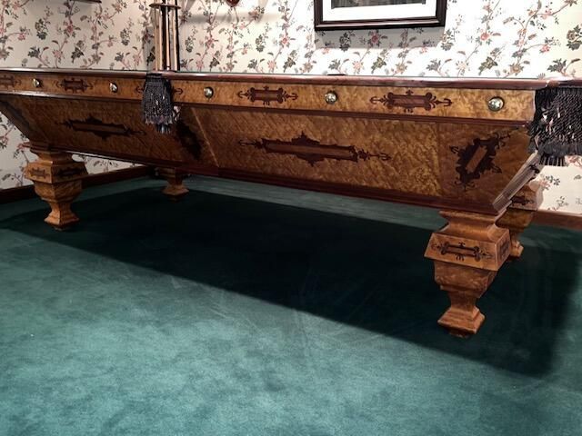 A pool table with a label on it that says vivex cushion boston.
