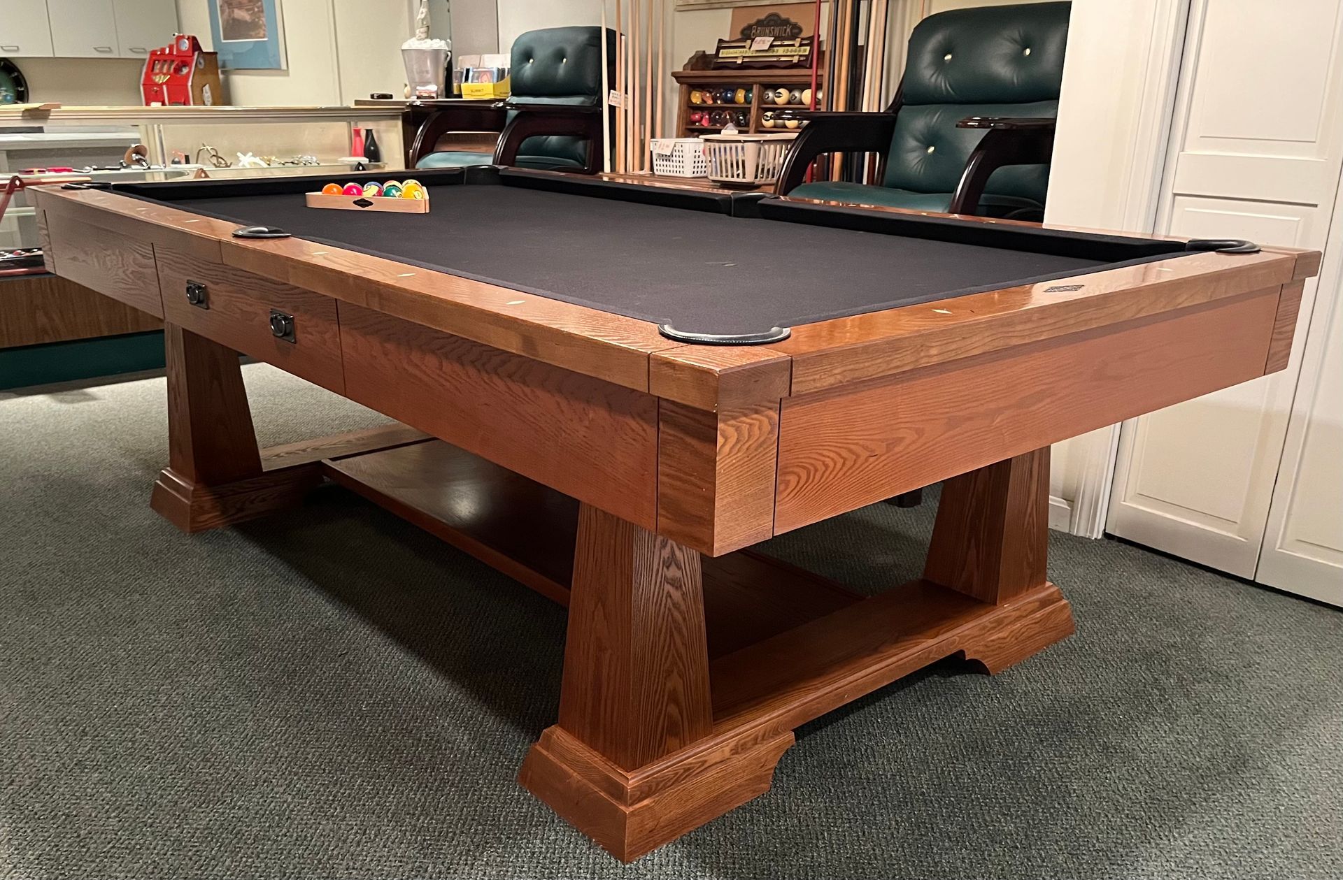 A pool table is sitting on the floor in a room.