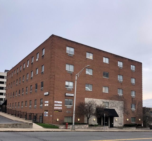 A large brick building with a lot of windows