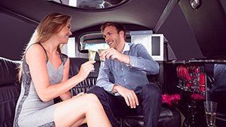 Couple drinking in limo
