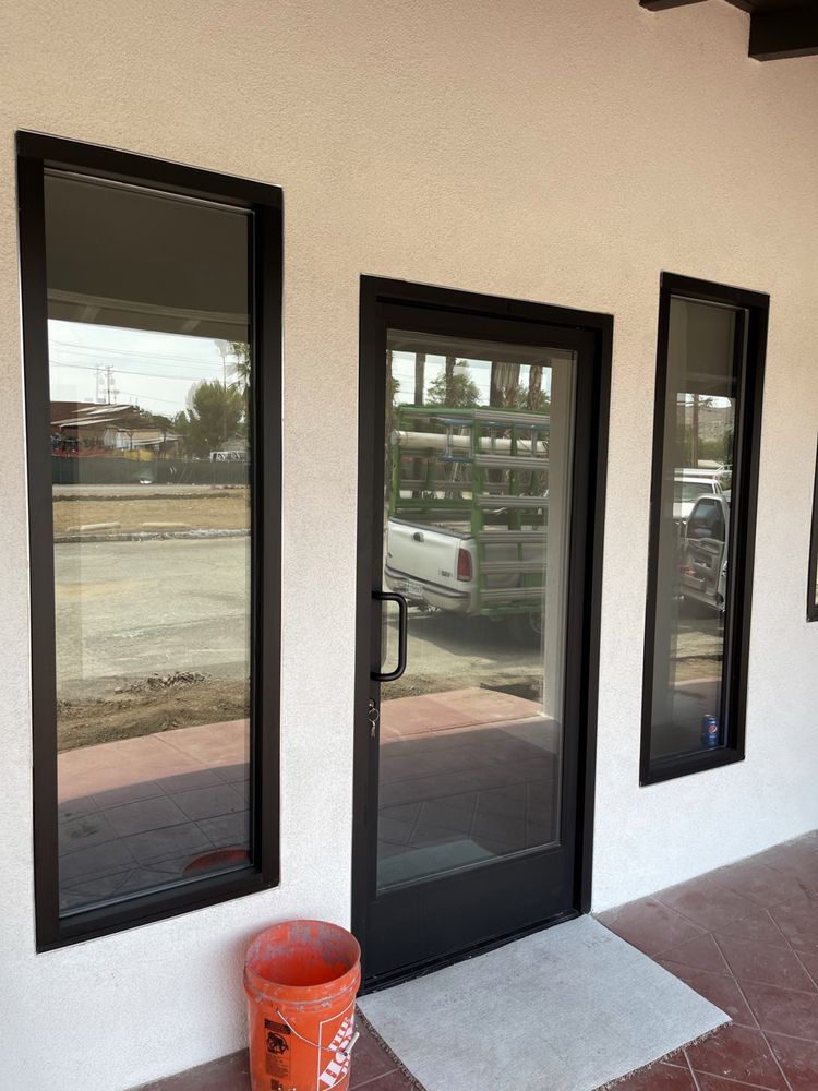 A door with a bucket in front of it that says home depot