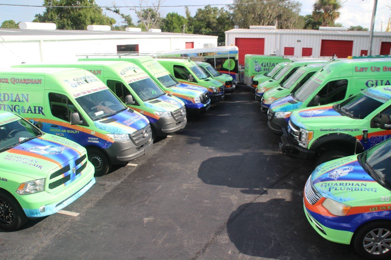 A parking lot filled with company vehicles.